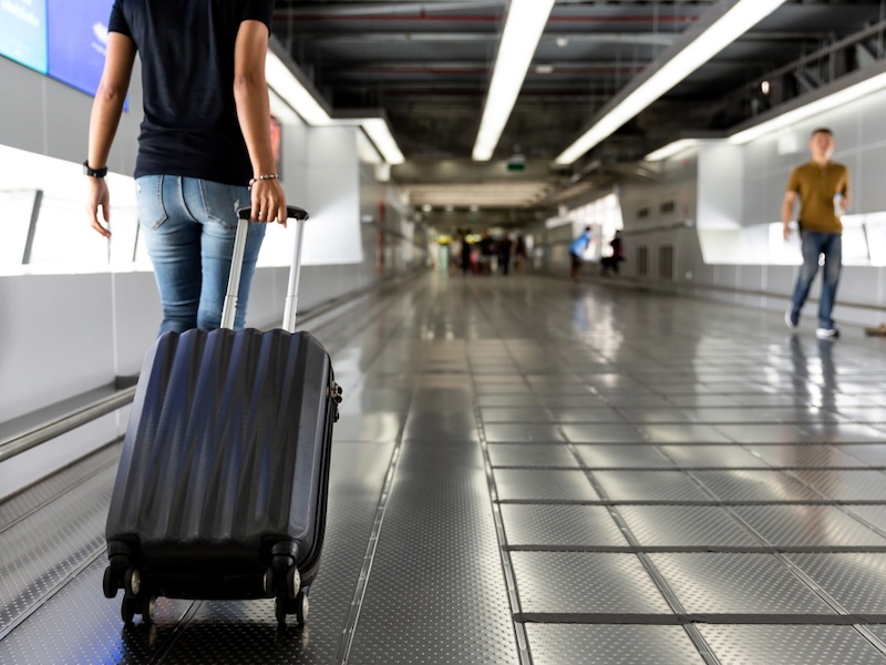 Lone female traveller at airport