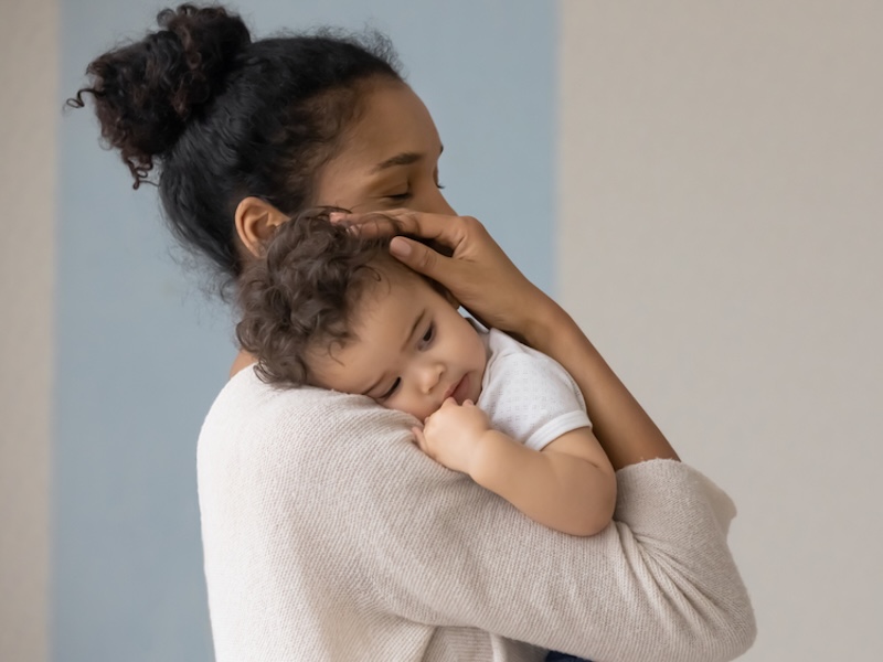 Woman with baby at home